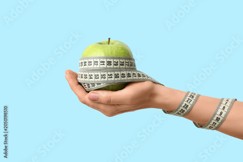 Female hand with fresh appl...