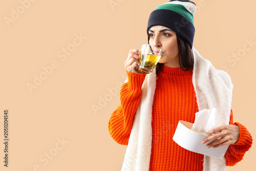Sick young woman with tissu...