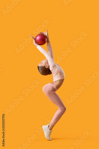 Cute girl with ball doing g...