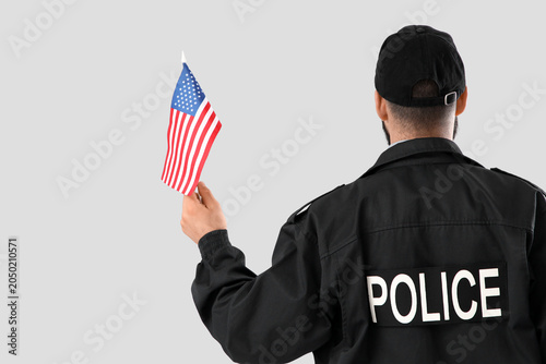 Police officer with USA fla...