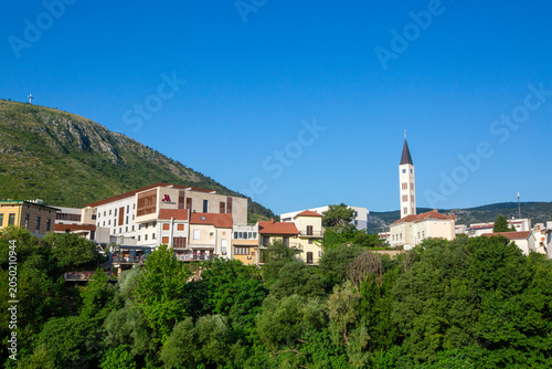 Konstfotografi Scenic View of Mostar Peace Bell Tower and Marriott Hotel with Hum Mountain in B