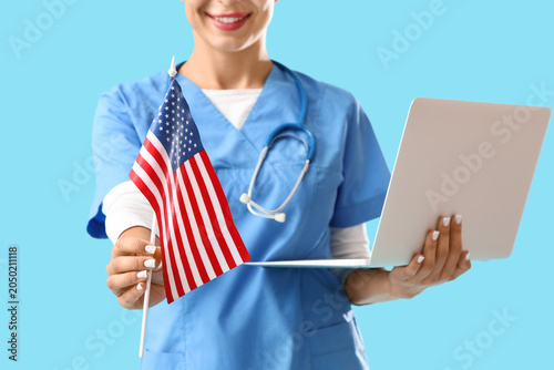 Female doctor with laptop a...
