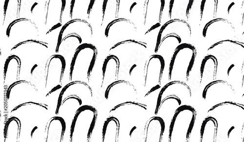 Fotografie Black ink brush curved arch pattern forming repeating organic semi-circle shapes