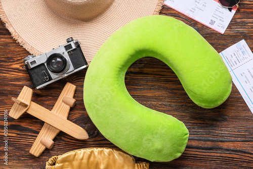 Travel pillow, photo camera...