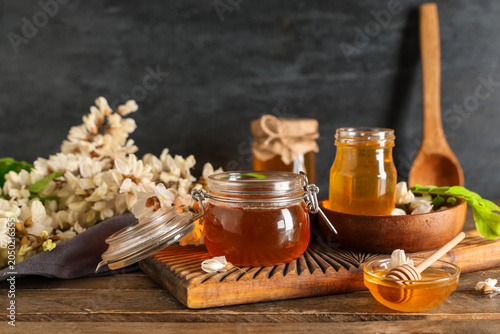 Jars and bowl of sweet hone...