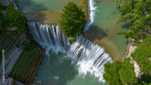 Tableau sur toile Scenic View of Pliva Waterfall and Historic Fortress on a Hill in Jajce Bosnia a
