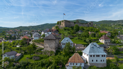 Obraz na płótnie Historic Jajce Fortress and Bear Tower with National Flag on Hilltop in Bosnia a