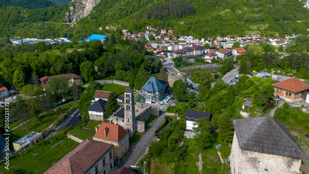 Fototapeta premium High Angle Aerial Panoramic View of Jajce Old Town with St Lukes Bell Tower and Medvjed Kula Bear Tower in Bosnia and Herzegovina