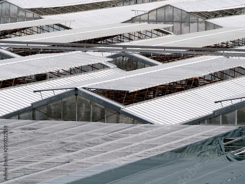 Glass and fiberglass greenhouse roofs