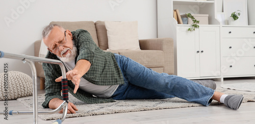 Senior man lying on floor a...