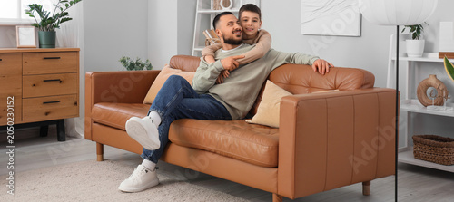 Happy father hugging with h...