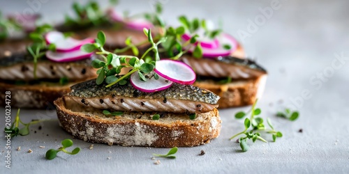 Freshly sliced salmon on bread garnished with radishes and herbs  