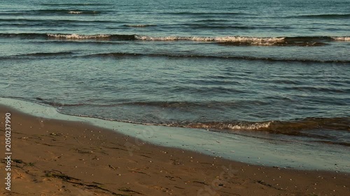 Gentle Ocean Waves On Sandy Shore
