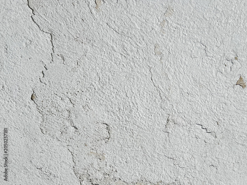 Obraz na plátně close up of distressed wall with cracked plaster and peeling paint rough grunge