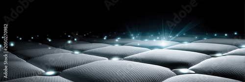 Smart sleep technology concept showing a textured mattress surface with glowing data points and digital light signals optimizing sleep performance and health analytics