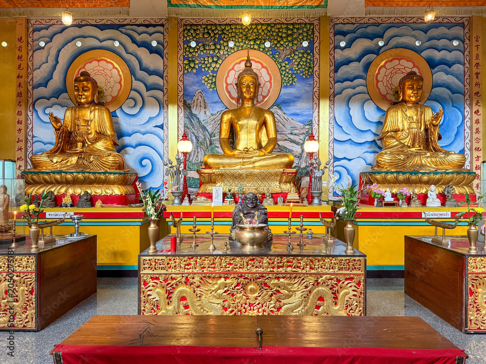 Fototapeta premium Golden Buddha statues on temple altar, Chiang Mai, Thailand