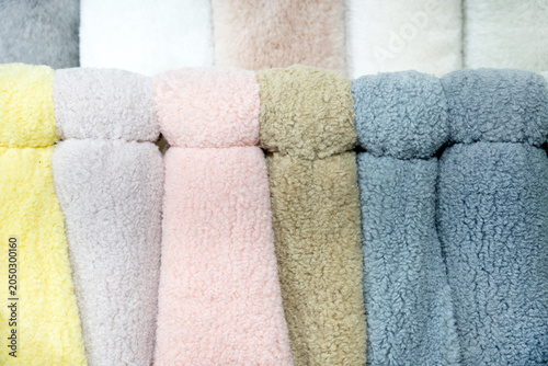 Fur fabric on a rack. Beautiful fur for sewing fur coats at the factory.