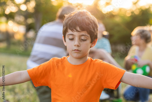 Fotografia Sad child feeling excluded from family playing