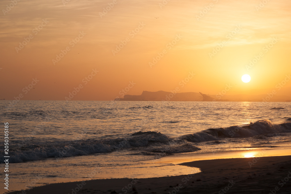 Fototapeta premium Al Baleed Beach sunset over the Arabian Sea in Salalah, Oman