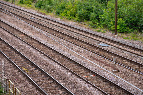 Photos High angle diagonal view of parallel steel railway tracks and gravel ballast