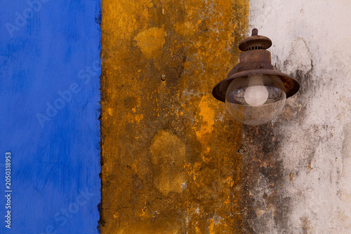 Photography Street light on a colorful wall in Obidos, Portugal