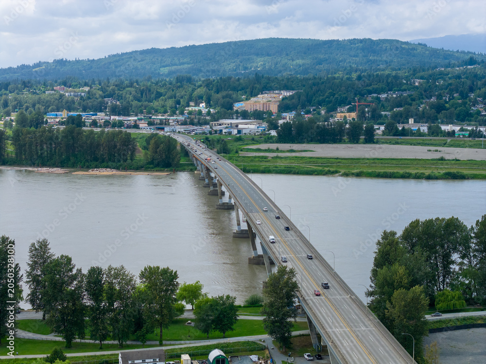 Obraz premium Highway Bridge Crossing the Fraser River Near Abbotsford and Mission, BC, Canada