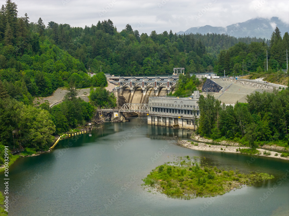 Fototapeta premium Hydroelectric Dam and Reservoir at Mission BC Canada Surrounded by Forested Mountains and River