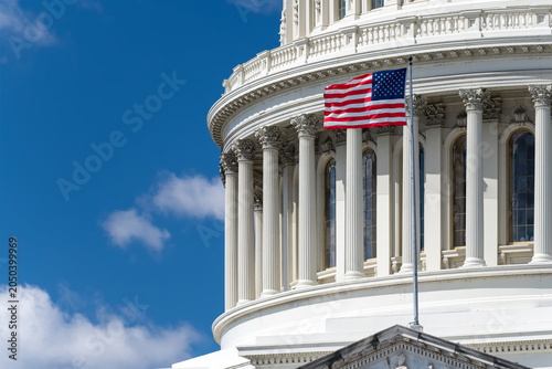 American Flag Flying In Front Of United States Capitol Dome Architecture