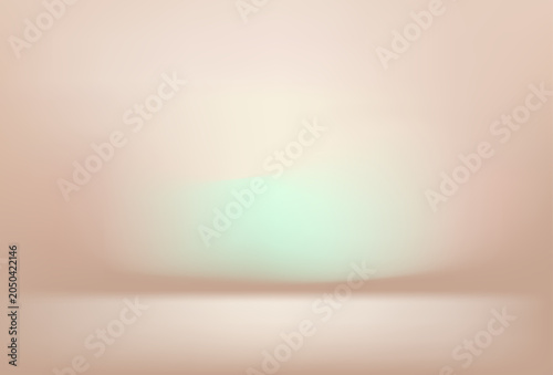 Foto A brightly lit studio with a blurred background featuring a soft peach wall and