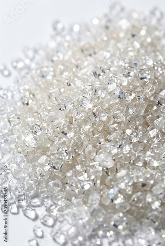 Macro Shot of Sparkling White Sugar Crystals Pile on White Background