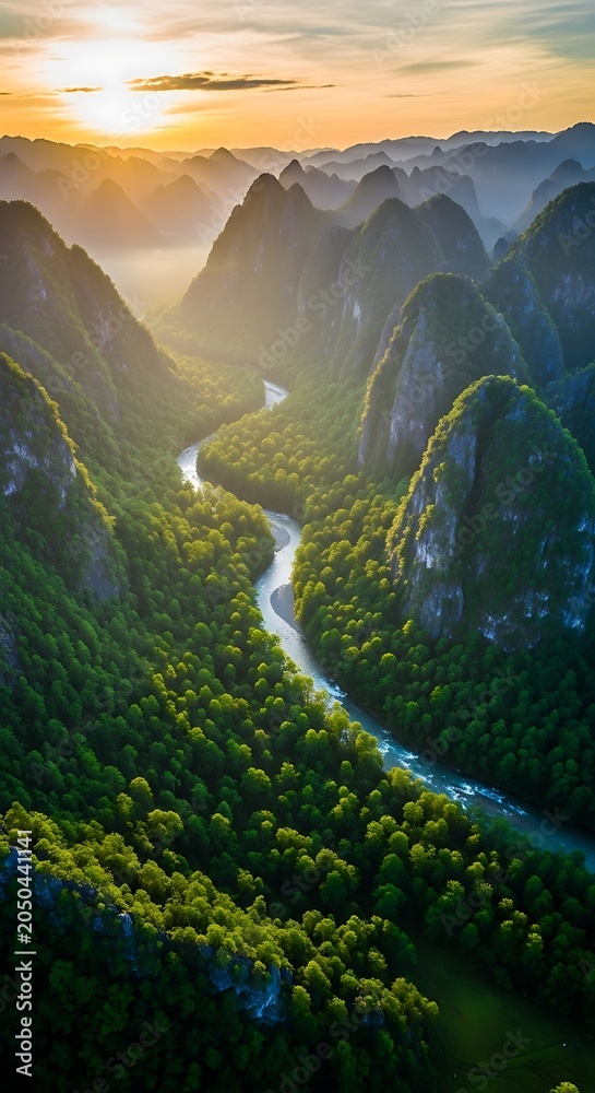 Fototapeta premium Aerial view of lush green valley winding river.