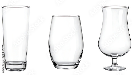 Set of three empty clear glass drinking vessels, tall highball, curved tumbler, and stemmed hurricane glass, isolated studio shot