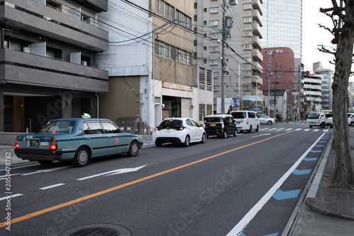 Fotografie Urban street view with modern architecture and traffic in a Japanese city 일본 도심의