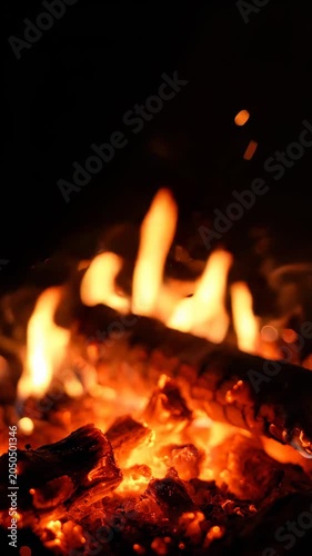 Close-up of burning fire with glowing embers.