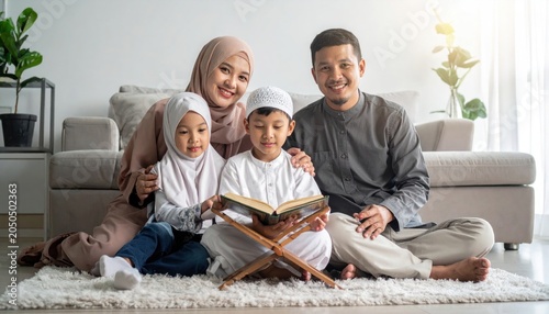 Portrait of happy Muslim family with children reading the Quran and praying together at home.