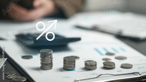 Fotografía Financial comparison of interest rates, savings returns, and investment yields using charts, coins, and analytics