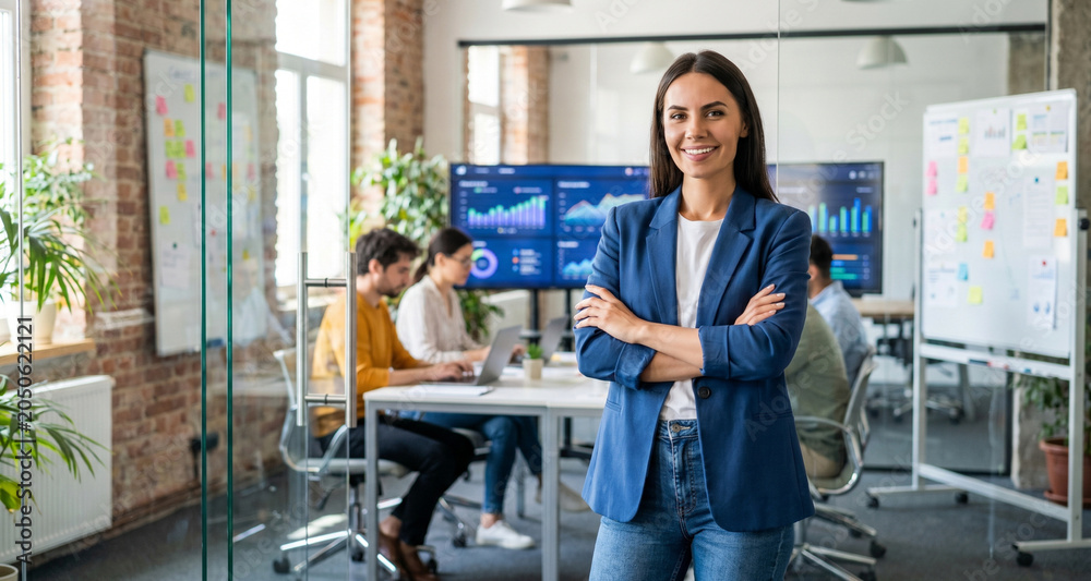 Fototapeta premium Confident Businesswoman Standing in Modern Office Environment