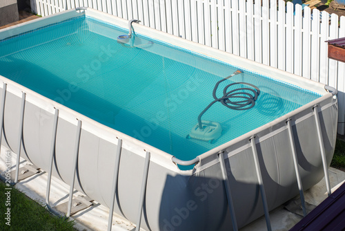 Schilderij op canvas Robotic pool cleaner working underwater to keep swimming pool clean
