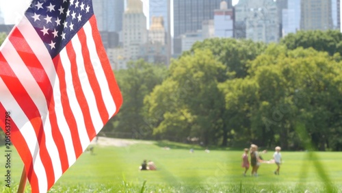 Fotografija American flag on green grass in Central Park, New York, USA
