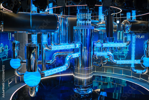 Bild auf Leinwand Water-to-water power reactor features complex piping and illuminated blue compon