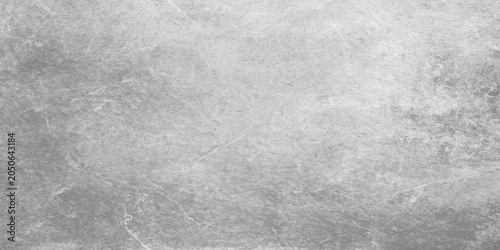 Fotografía Grey plaster wall textured background with subtle white accents and faint scratc