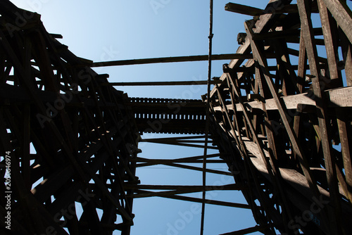 Historic Wooden Railroad Trestle Structure Looking Up, Silhouette Against Blue Sky, Oregon