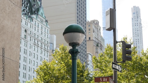 New York City subway globe lamp, green orb metro entrance sign, United States. American underground lantern, Manhattan transport. Metropolitan station on 5 fifth avenue, Pulitzer Plaza, Central park.