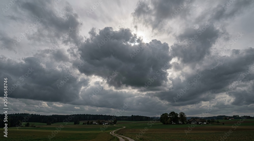 Naklejka premium storm clouds over the field