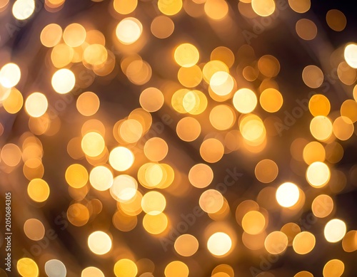 Golden bokeh lights abstract background texture.