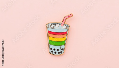 Chic enamel pin showcasing a vibrant beverage with tapioca pearls and a straw, ideal for enhancing bags and jackets.
