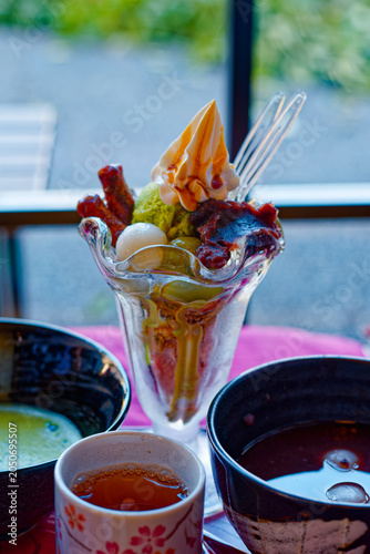 Japanese dessert parfait with ice cream and fruit in cafe