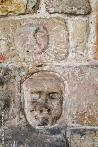 Carved stone faces and symbols in St Nicholas of Bari church in the old town of Aviles city, Asturias