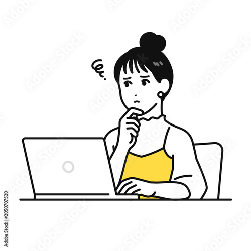 pc画面を見て悩むまとめ髪の若い女性