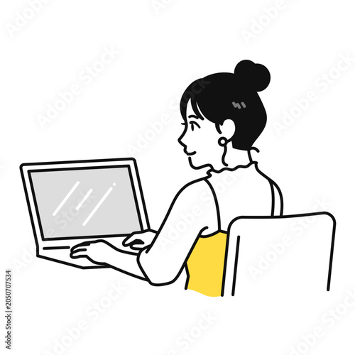 在宅ワークでpcを操作するまとめ髪の若い女性の後ろ姿